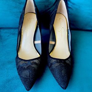 Mesh and lace pointy toed stilettos.